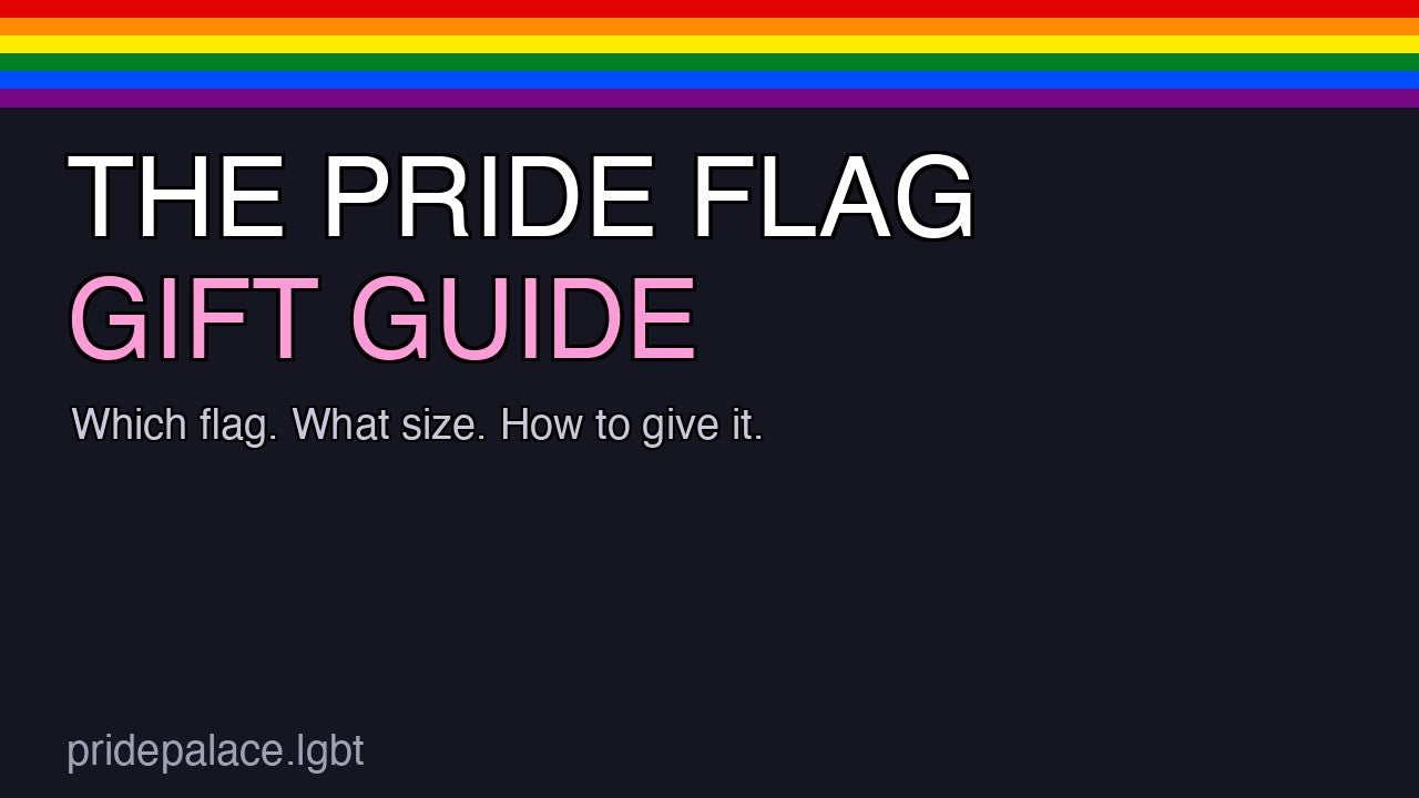 A folded rainbow Pride flag on a warm surface with the text The Pride Flag Gift Guide in bold pink lettering.