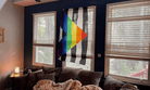 Ally Flag hung in a living room window
