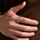 Pansexual Pride Ring worn on a hand