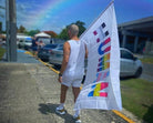 Customer photo with the We're All Human Flag