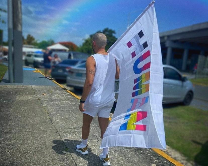 Customer photo with the We're All Human Flag