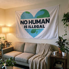 No Human is Illegal Flag hung above a living room couch